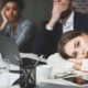 Three people in a boring business meeting.